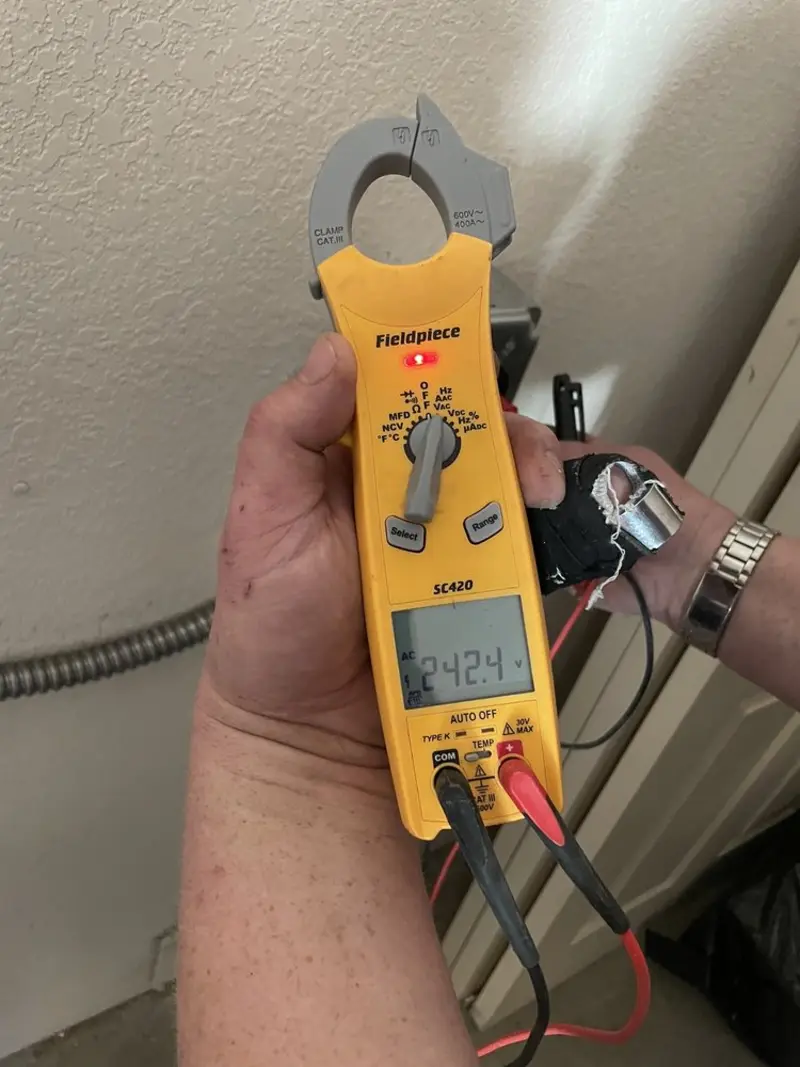 Voltage testing with clamp meter during Electrical Installation Services in Fresno